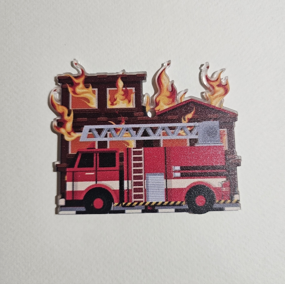 Firefighter fire truck and a burning house christmas ornament.